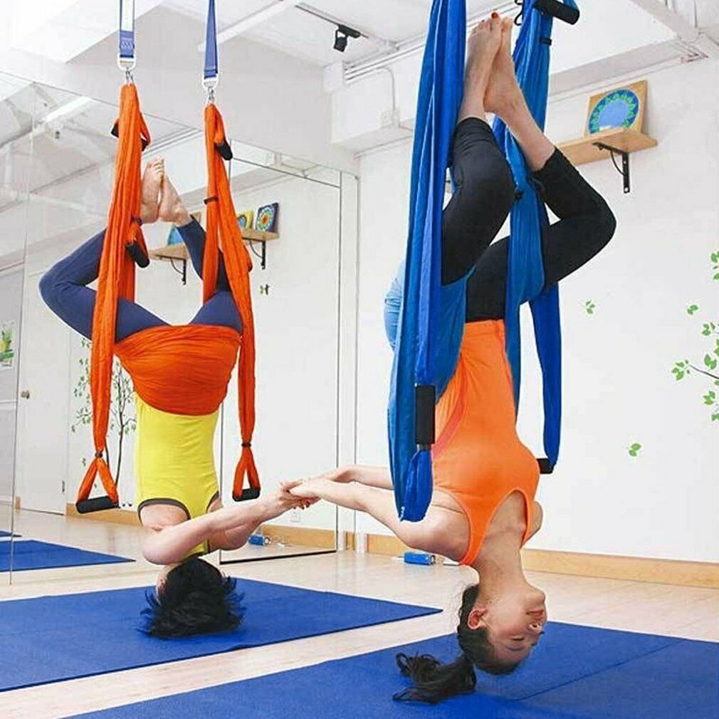 Aerial Yoga: Safety Tips, Benefits, and 5 Poses To Try